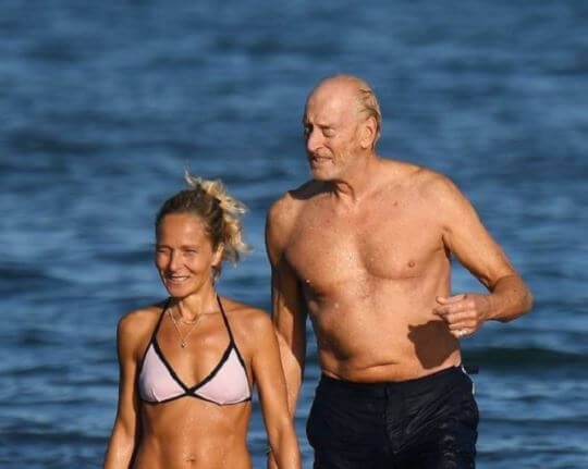 Joanna Haythorn's ex-husband, Charles Dance with his girlfriend, Alessandra Masi on the beach.
